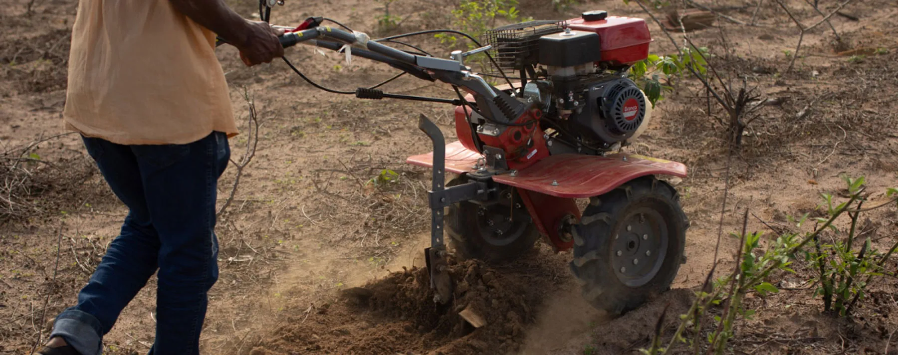 Guy driving a monocultivator